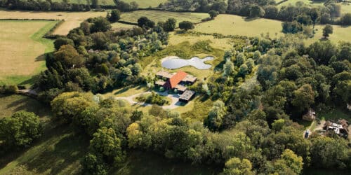 Aerial view of New Surries, a paragraph 84 house in the High Weald National Landscape by Hawkes Architecture Ltd