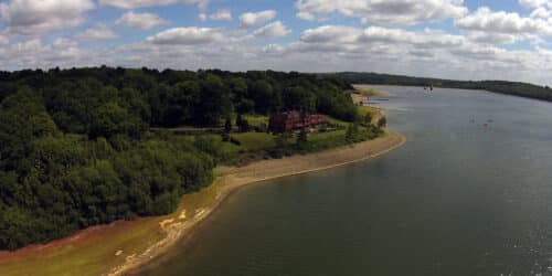 Aerial view of the site at Waterside, a replacement dwelling designed by Hawkes Architecture.