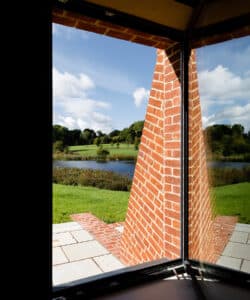 Brick buttress blinker detail from the snug at Lake House, a Para 79 energy efficient passive house. Another grand design by Hawkes Architecture.