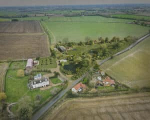 Aerial view of the site at Flybarn farm, a Para 84 energy efficient passive house. Another grand design by Hawkes Architecture.