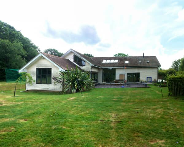 Rear view before the eco extension & transformation project by Hawkes Architecture Ltd