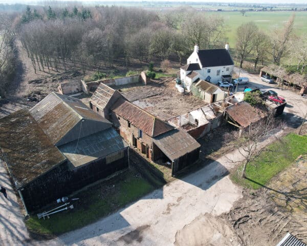 Aerial view during demolition works at Dales Mount Farm. A replacement farmstead designed by Hawkes Architecture Ltd